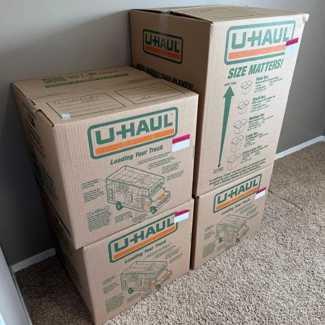 Packed moving cartons inside a home