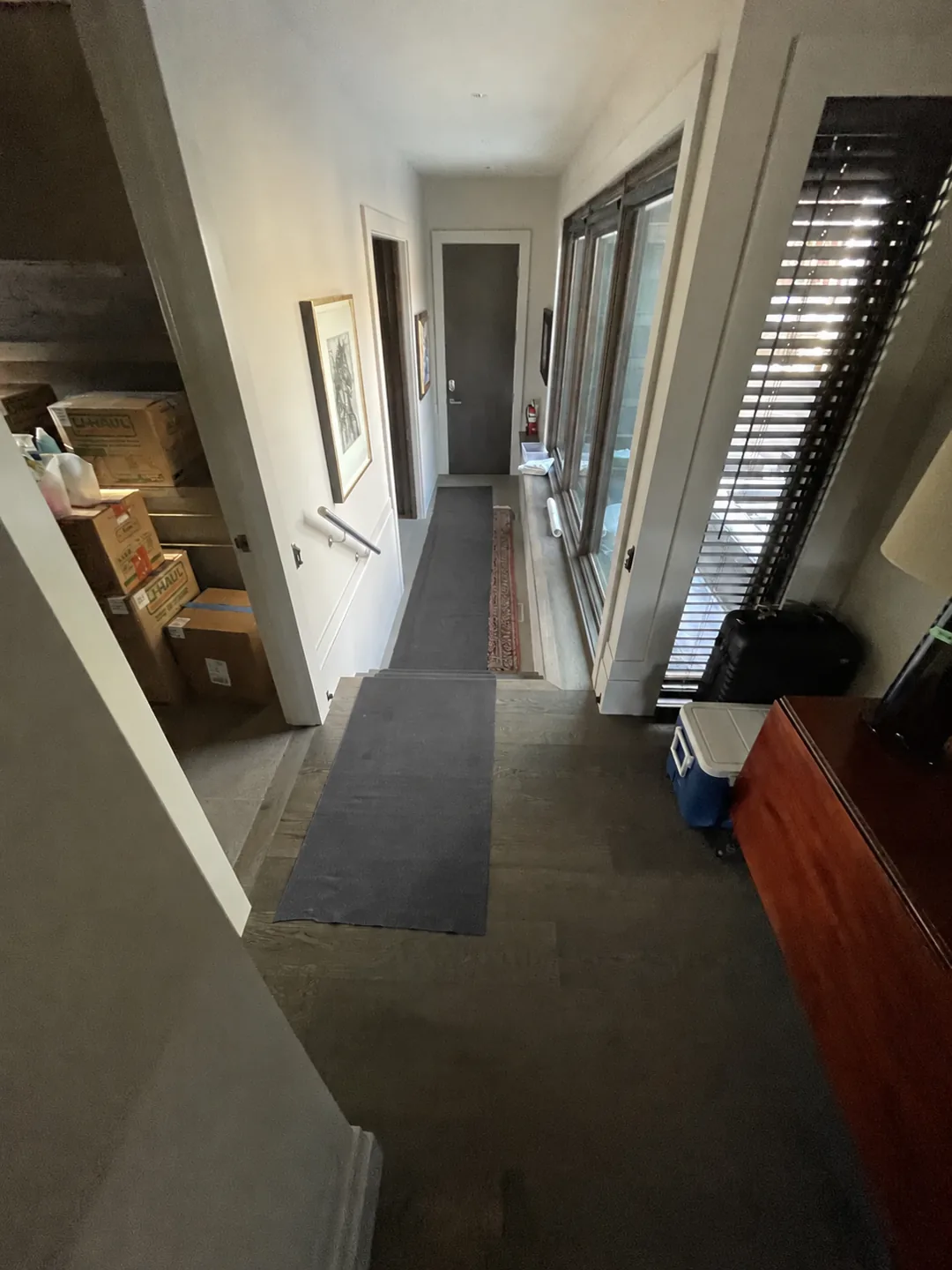 Charcoal floor runners protecting a hallway and stairs