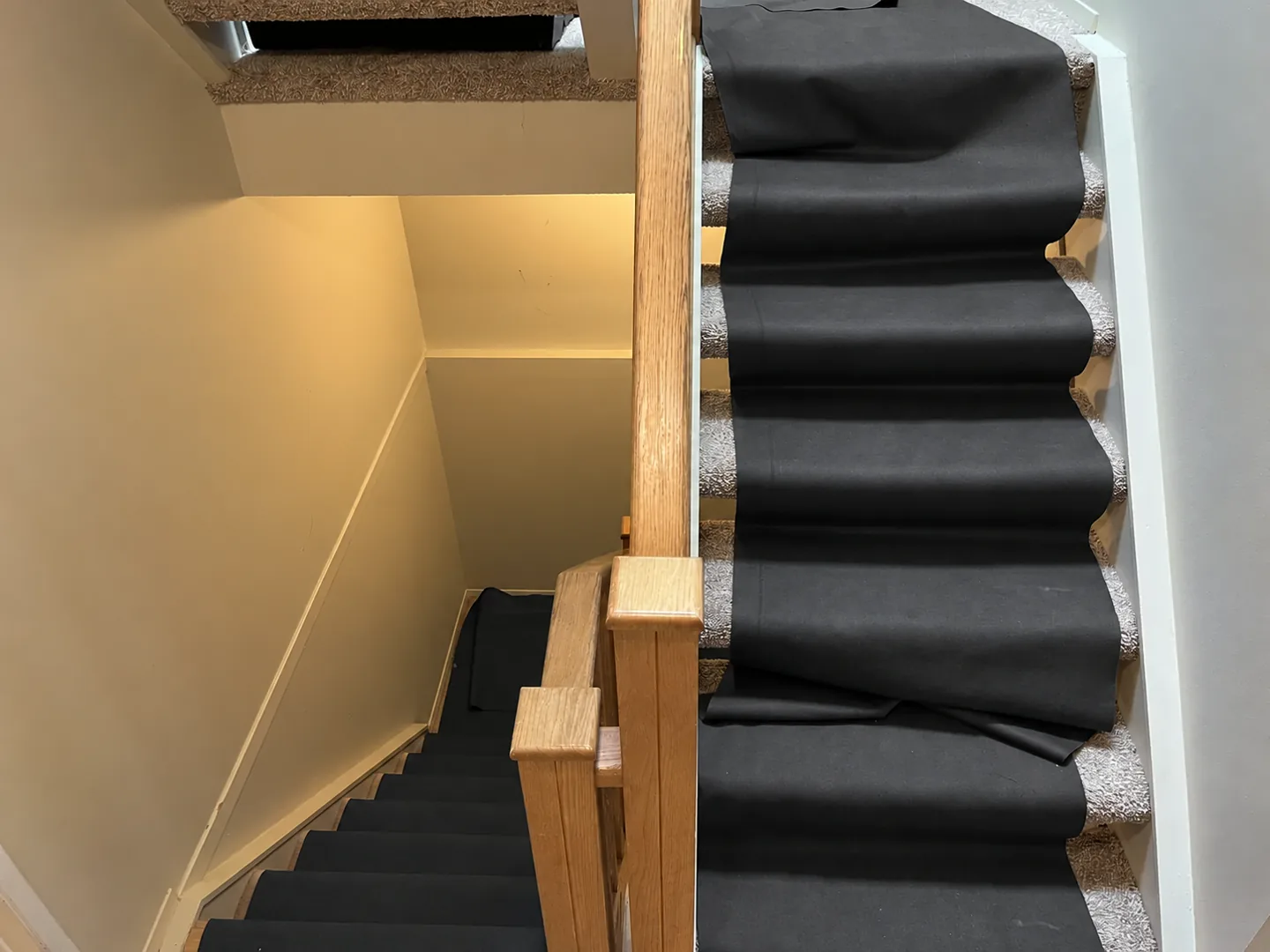 Charcoal protective runners over a staircase